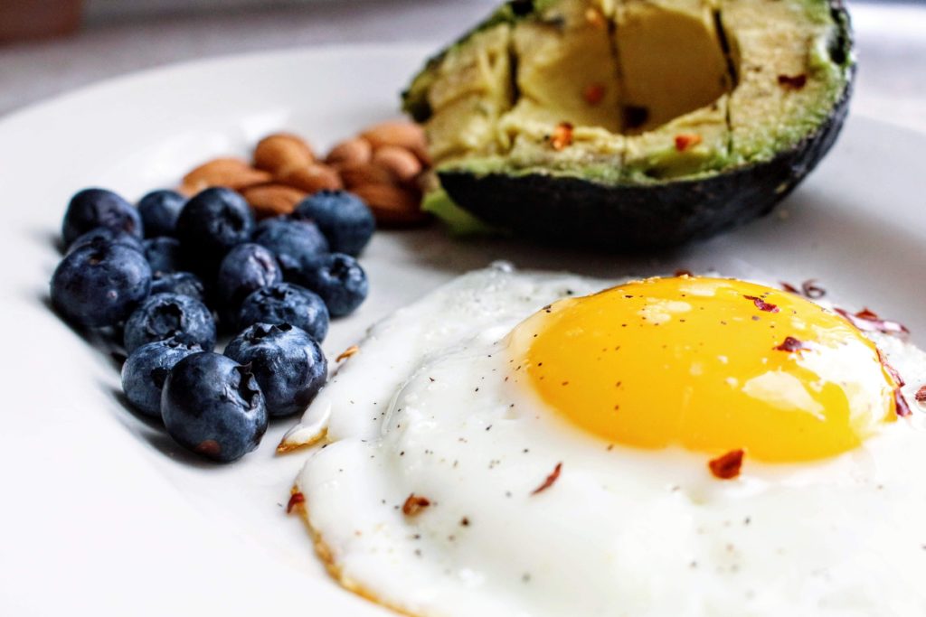 Losing weight after 50 by eating healthy foods Eggs, avocado, blueberries and nuts.